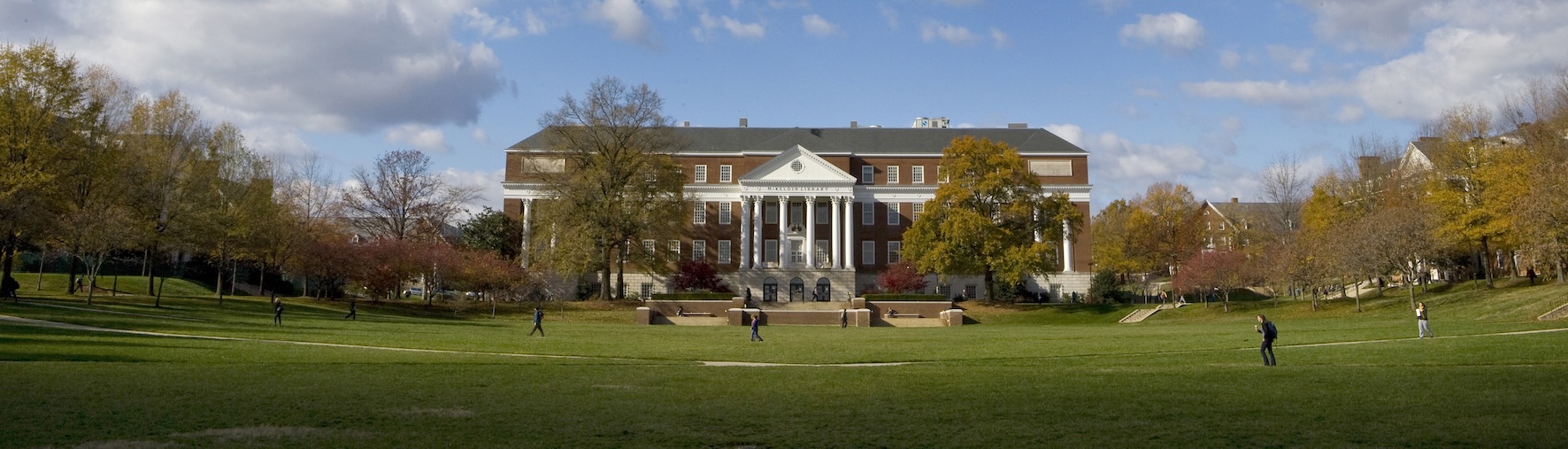 Campus walkway with trees and engineering buildings